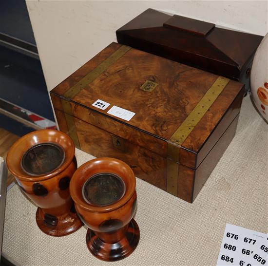 A Victorian walnut writing slope, a mahogany sarcophagus tea caddy and two turned wood vases.